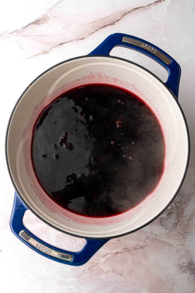 Dark brewed hibiscus tea in a pot.