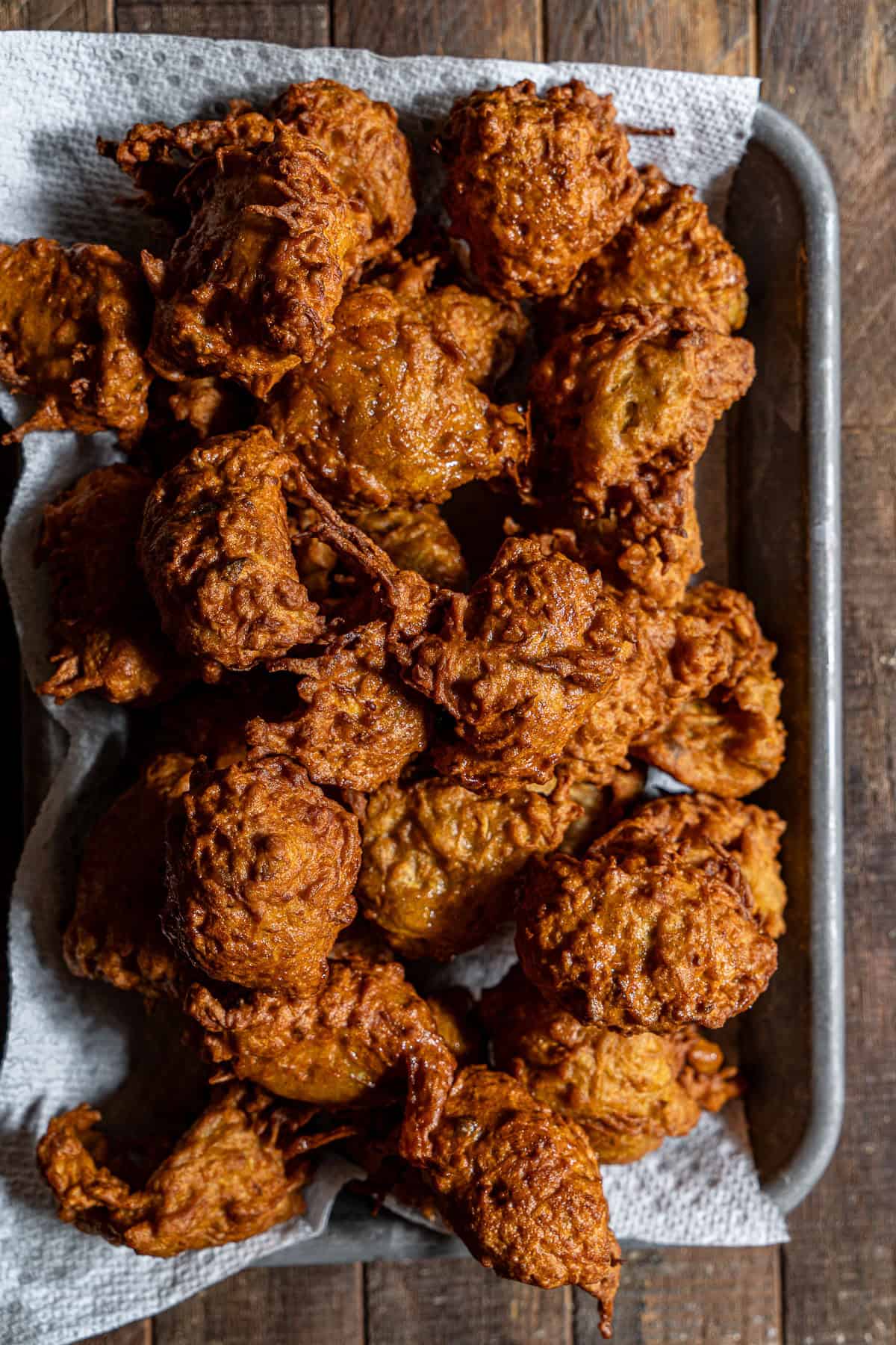 Lauki koftas freshly fried and golden brown in a tray.