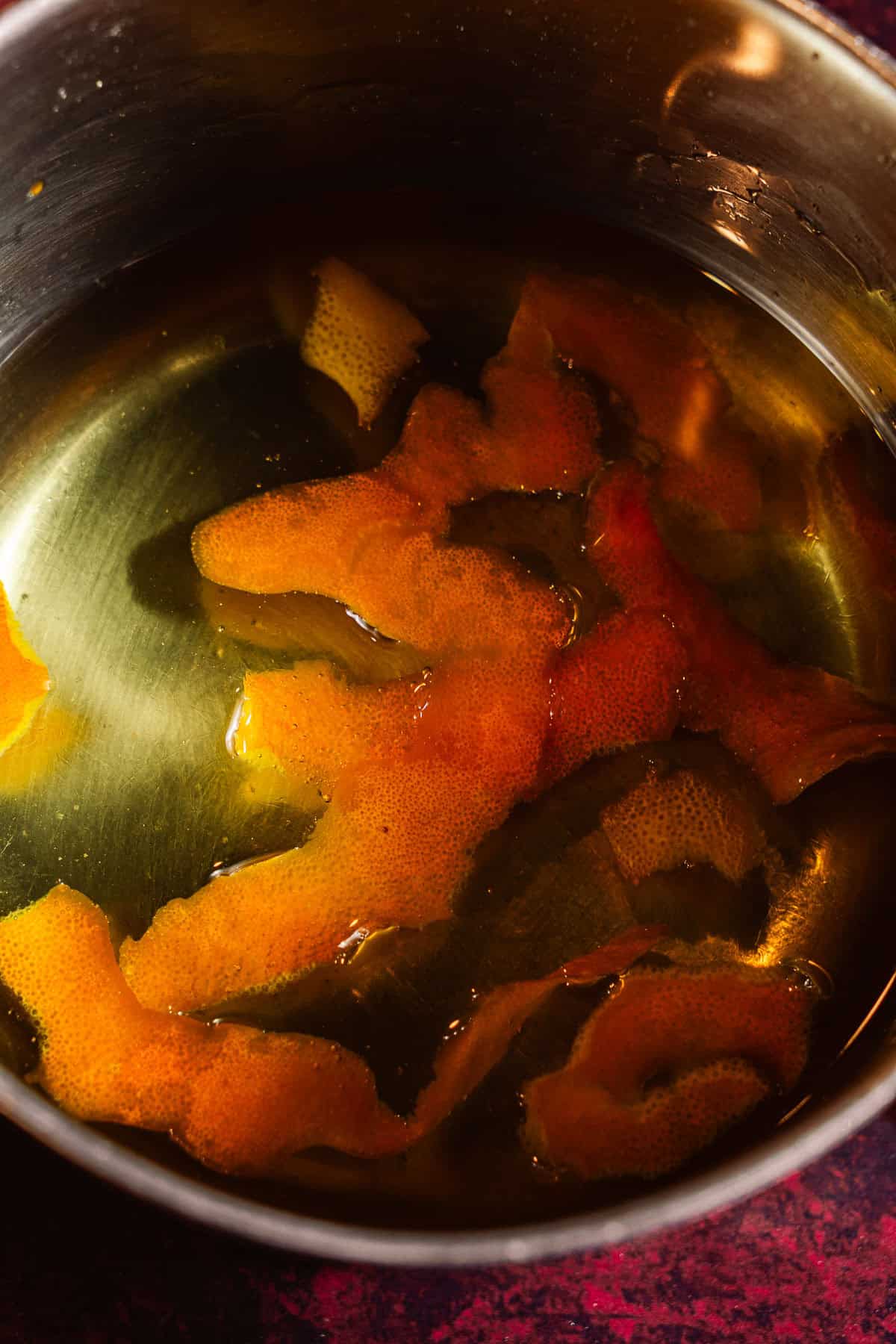 Orange peels simmered in sugar water.
