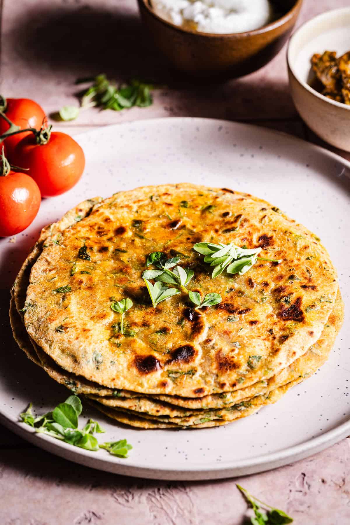 A stack of buttery methi paratha.