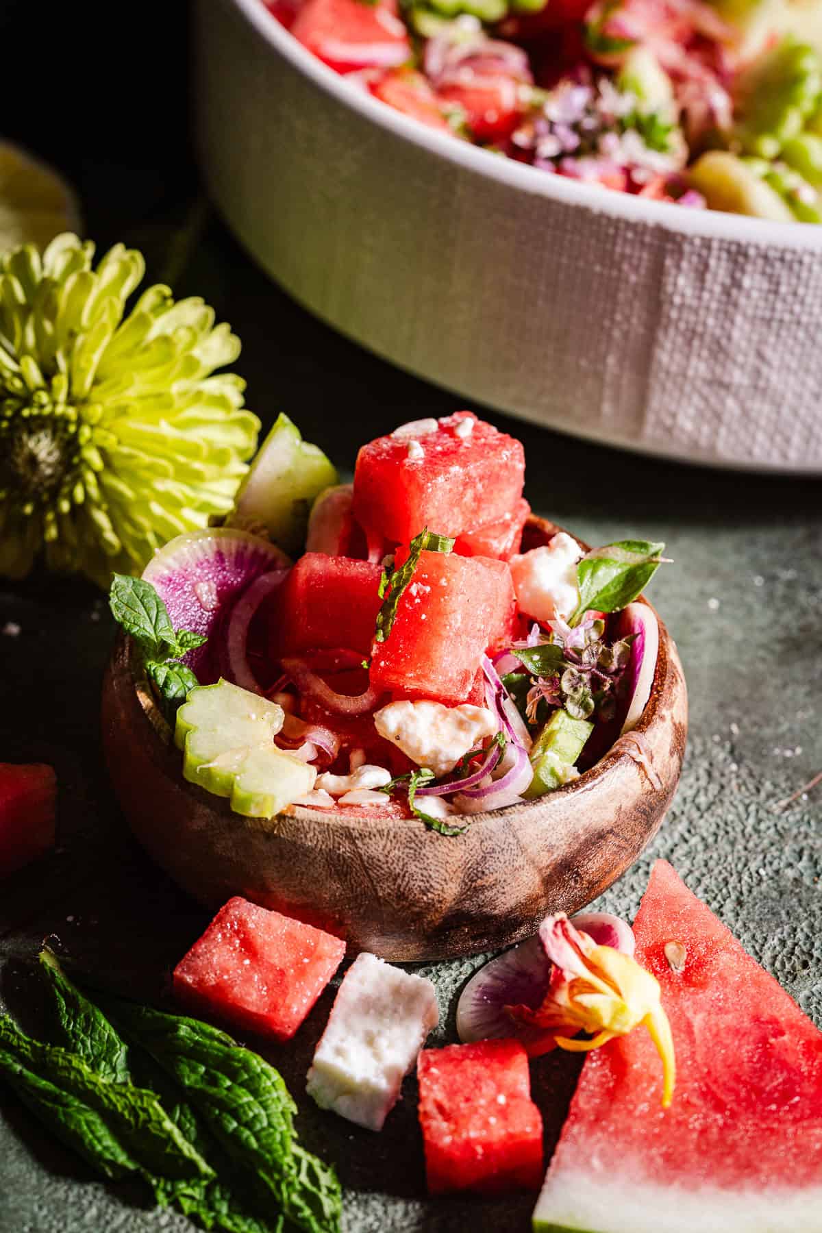 A small bowl wit a serving of the watermelon feta salad.
