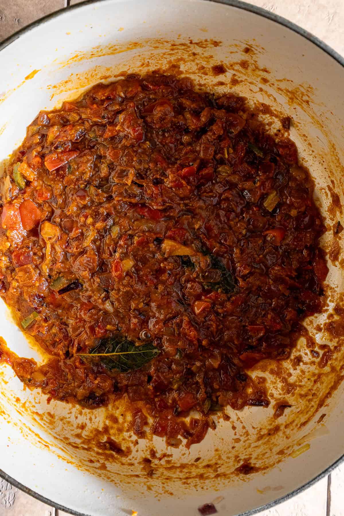 Cooked onion tomato masala for chicken curry.