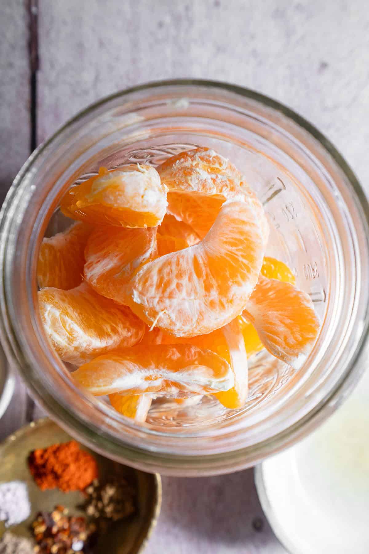 Peeled mandarin orange in a jar.
